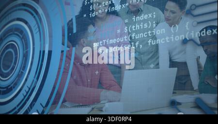 Reviewing team members in business casual leaning over laptop in meeting room, showing code overlay Stock Photo