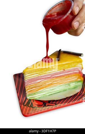 Die cut of rainbow crepe cake on white isolated. Stock Photo