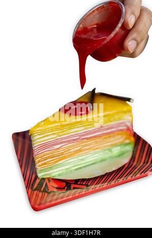 Die cut of rainbow crepe cake on white isolated. Stock Photo