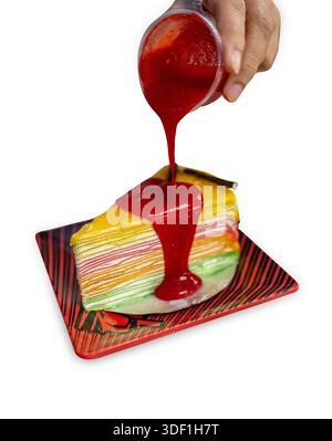 Die cut of rainbow crepe cake on white isolated. Stock Photo