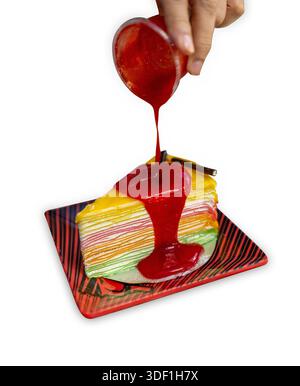 Die cut of rainbow crepe cake on white isolated. Stock Photo