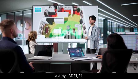 Man Giving Presentation On Wireless Signal Strength In Typical Home Stock Photo
