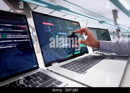Professional Programmer Using Node Editor For Visual Scripting And Training Stock Photo