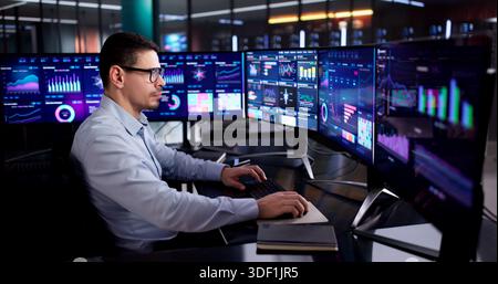 Hispanic Data Analyst Analyzing KPIs On Business Desktop Dashboard Stock Photo