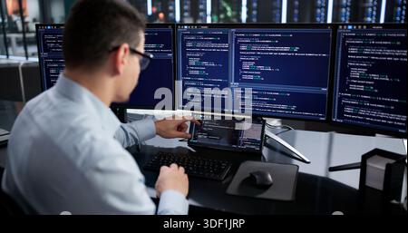 Hispanic Programmer Developing Software On Mini Computer For Data Analysis. Stock Photo