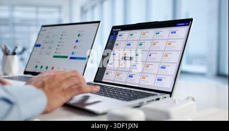 Man Organizing Contracts And Invoices With Document Management Software Online. Stock Photo