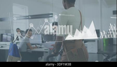 Pausing woman wearing light top tan pants, woven bag holding bike at office, showing data overlays Stock Photo