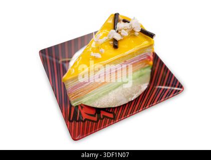 Die cut of rainbow crepe cake on white isolated. Stock Photo