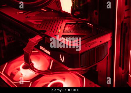 Rome, italy 1 january 2026: zotac geforce rtx gpu glowing with red led fans inside a high-performance gaming pc case, close-up of modern hardware Stock Photo