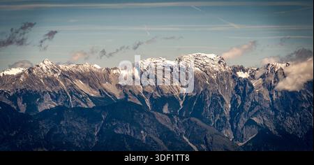 Snow-capped mountain range under a clear blue sky. Stock Photo