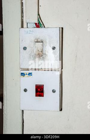 old and dirty light switch on a lodge, Kinabatangan, Sabah, Borneo, Malaysia Stock Photo