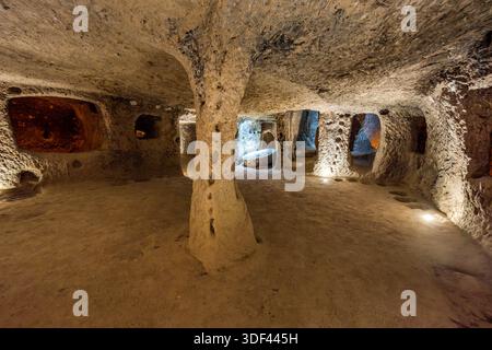 Ancient cave dwellings with columns and corridors in Nevşehir Merkez, Nevşehir, Türkiye Stock Photo
