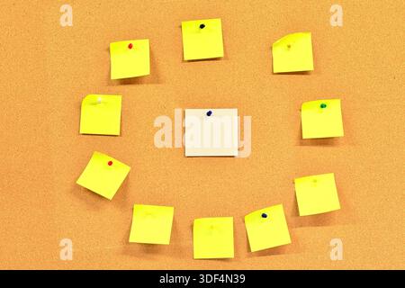 Blank white square note paper with yellow square blank note papers around it. Stock Photo