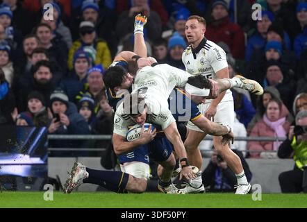 Aviva Plus Roche Dan Sheehan of Leinster tackled by Jack O'Donoghue of Munster during ...
