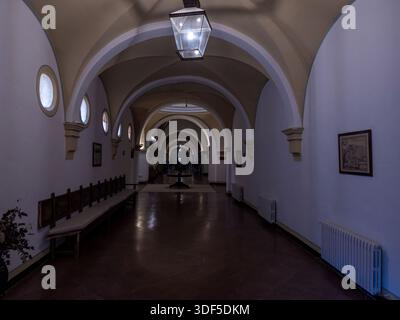 Hallway with arches and vaulted ceiling creating architectural perspective in a building interiorraw Stock Photo