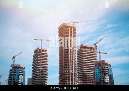 Tall modern building being built from concrete Stock Photo