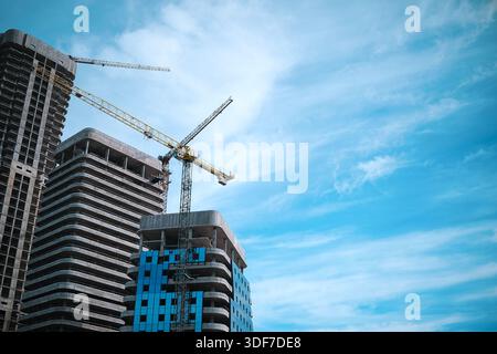 Tall modern building being built from concrete Stock Photo