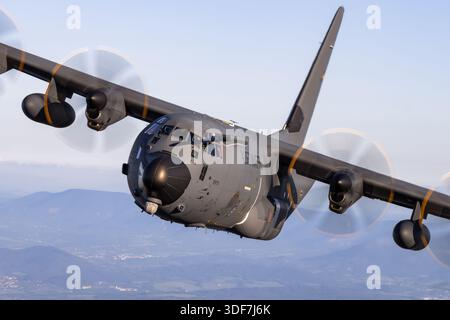 A close-up pilot view of the German Air Force Lockheed Martin KC-130J Hercules Reg. 5505, Serial 382-5971, during air-to-air operations at NATO Days 2025 shows cockpit instrumentation, crew activity, and flight controls. The KC-130J is a four-engine turboprop military transport aircraft capable of aerial refueling, cargo transport, and personnel deployment. This display emphasizes pilot control, aircraft handling, and operational performance in a NATO airshow environment. Stock Photo