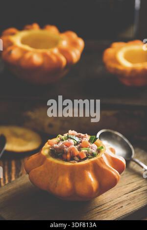 Raw pattypan squash stuffed with ground meat, carrot and leek on cutting board Stock Photo