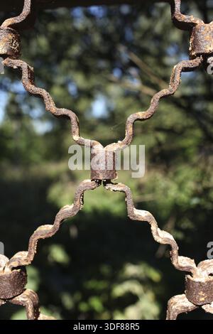 Rusty old Metal Grate on a background of nature Stock Photo
