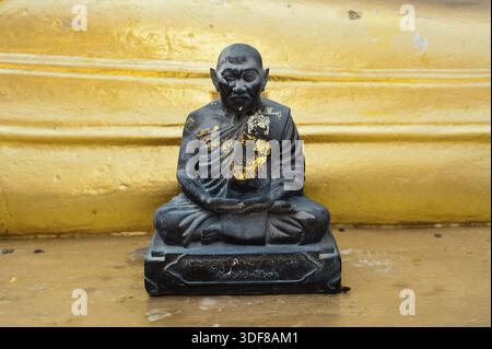 Black monk statue in Wat Phra Yai Temple. Koh Samui island, Thailand Stock Photo