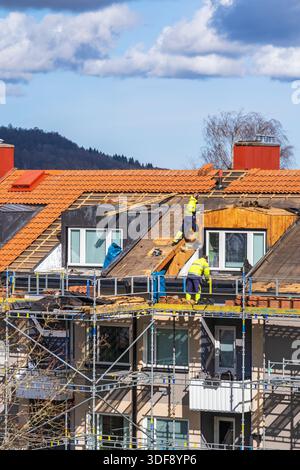 Work on a roof with scaffolding Stock Photo