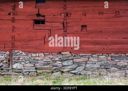 Red timbered old house with stones Stock Photo