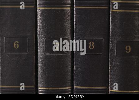 Golden numbers on the bindings of old books Stock Photo
