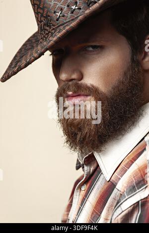 Young handsome man in a cowboy hat Stock Photo