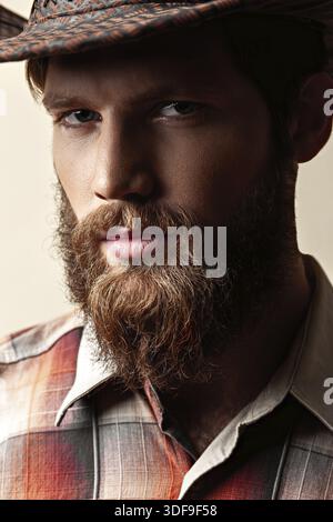 Young handsome man in a cowboy hat Stock Photo