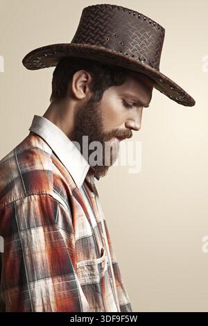 Young handsome man in a cowboy hat Stock Photo