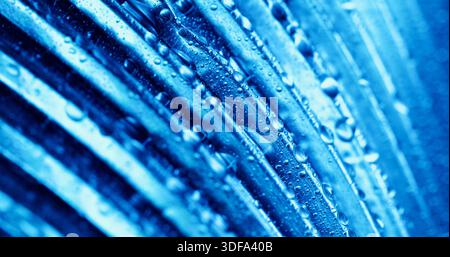 Water drop background. Blur line light. Blue rain dew on corrugated texture. Bubble moisture on color liquid abstract uneven wall. Stock Photo