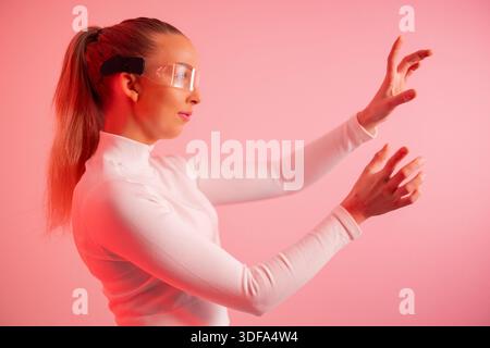 Young woman using futuristic technology Stock Photo