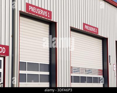 Senov, Czechia - November 25, 2024: Closed gates to tire service in Czech Republic Stock Photo