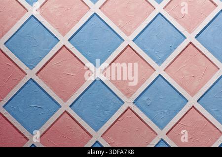 Diamond shaped pastel pattern painted on wall Stock Photo