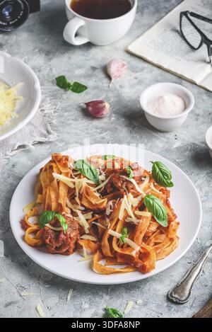 Pasta with mini meatballs, tomato sauce and parmesan cheese Stock Photo