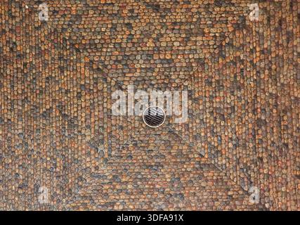 Close view of stone pavement with metal drain inside the historic town hall in Basel. Stock Photo