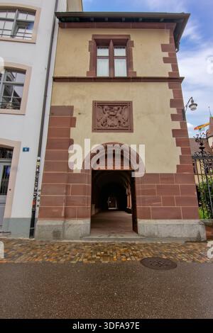 A historic building with an arched passage entrance in Basel old town. Stock Photo