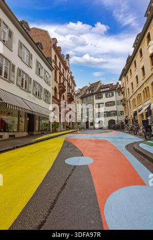 A colorful painted street in Basel with historic buildings and a calm urban atmosphere. Stock Photo