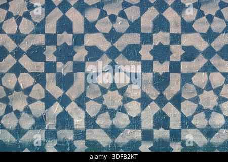 Reproduction of mural with geometric abstract pattern realized on blue background with stencil and white spray paint. Mission District, San Francisco, Stock Photo