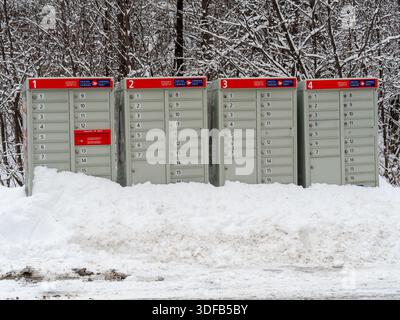 Row of Canada Post  community mailboxes in the winter,Quebec,Canada Stock Photo