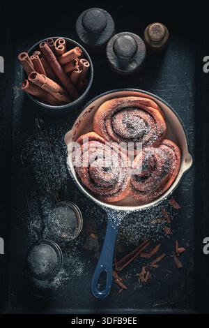 Tasty cinnamon buns as swedish dessert. Popular Swedish dessert. Swedish cuisine. Stock Photo