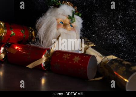 Father Christmas ornament  with Christmas Crackers Stock Photo