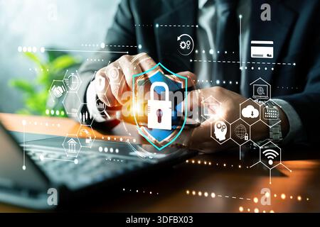 Businessman using smartphone with digital shield lock interface, securing online banking, payments and cloud data. Concept of cybersecurity, privacy, Stock Photo