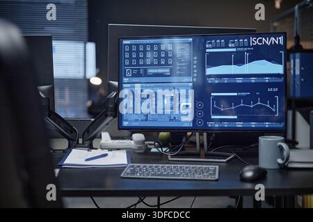 Modern Office Desk Featuring Computer Displaying Security System Interface Stock Photo