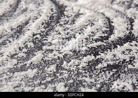 Flour Spread on a Dark Surface Creating a Beautiful Pattern During Baking Preparation Stock Photo