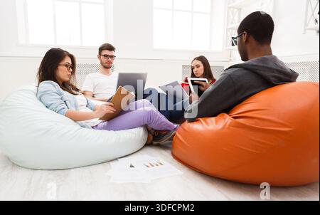 Students share opinions during break Stock Photo