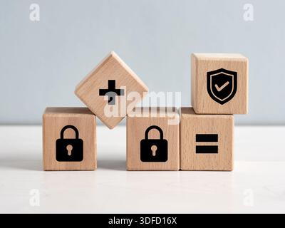 Cybersecurity concept is shown by padlocks and verified protection symbols on wooden cubes. Stock Photo