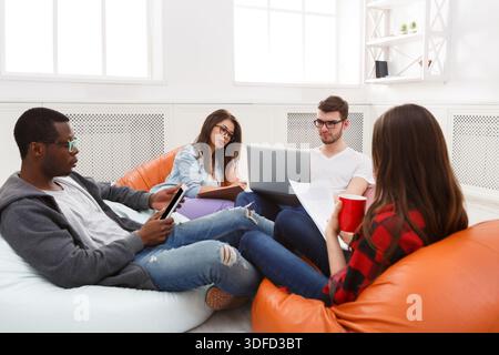 Creative professional designers discussing ideas Stock Photo