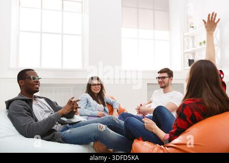 Creative professional designers discussing ideas Stock Photo